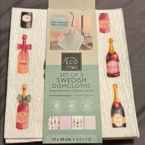 White and Pink Kitchen Linens Set with Decorative Design